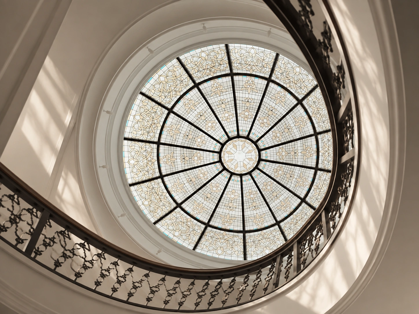 Architectural stained glass dome integrated into an interior space