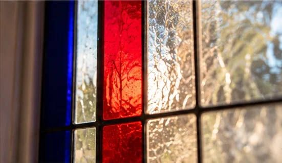 Close-up of bespoke stained glass craftsmanship by Zahra Tootzari