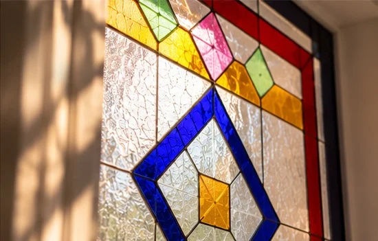 Close-up of bespoke stained glass craftsmanship by Zahra Tootzari